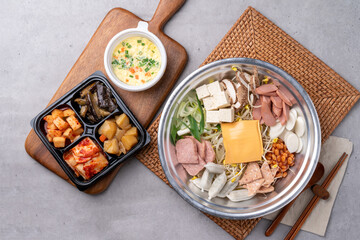 Fototapeta na wymiar Korean food, budae jjigae, galbitang, earthen pot, bulgogi, pork belly, grilled, side dishes, kimchi, cucumbers, potatoes, vegetables