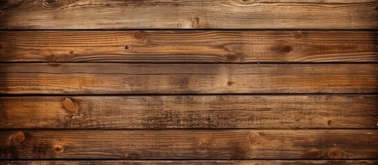 A wooden wall featuring a prominent wooden frame in the center, creating a visually appealing focal point. The frame stands out against the background, adding a touch of dimension to the overall