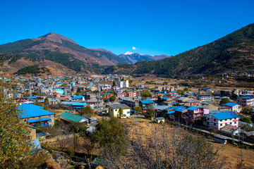 Fototapeta na wymiar Quaint Urban Landscape of Jumla Against the Himalayan Mountain Range, Nepal