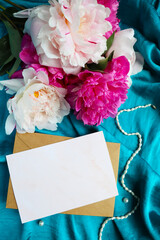 bouquet of peonies and white blank for text