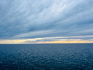 Sunset sea horizon, cloudy sky, dark cloudy sky at the seascape