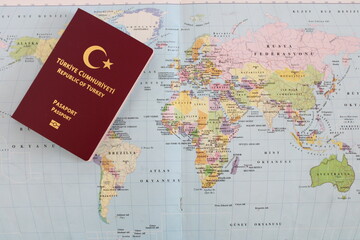 Turkish passport on world map
