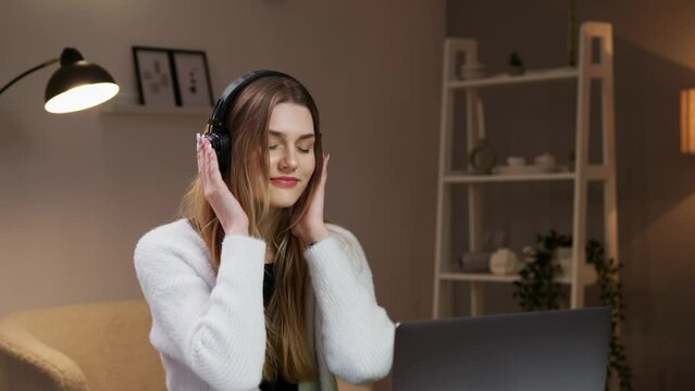 The girl enjoys listening to music