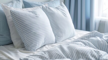 Fototapeta na wymiar White and light blue striped pillows with pattern