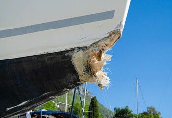 The bow of the yacht damaged by a collision with rocks