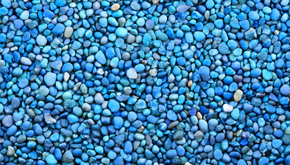 Blaue Kieselsteine, Hintergrund bestehend aus Kieselstein Granulat, Blaues Steingranulat, viele eingefärbte kleine Steine in der Farbe blau