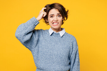 Young sad upset mistaken confused puzzled woman she wear grey knitted sweater shirt casual clothes...
