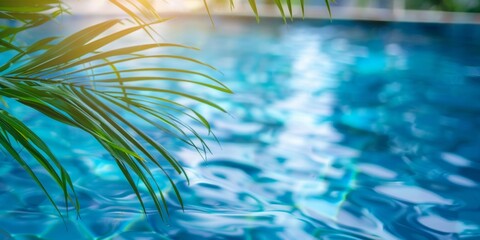 Fototapeta na wymiar Gentle palm leaves sway above a tranquil, crystal-clear swimming pool on a sunny day.