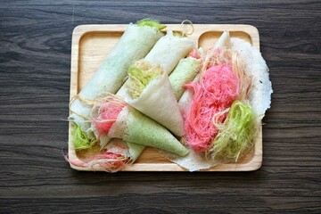 Thai cotton candy burrito pancake (Roti Saimai) on the table