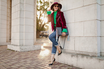 attractive woman in autumn style trendy outfit walking in street