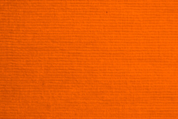 orange corduroy fabric texture used as background. clean fabric background of soft and smooth...