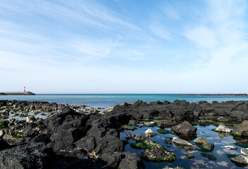 Fototapeta na wymiar View of the rocky seaside in Jeju Island