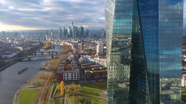 Dolly Flight through and Panorama at Frankfurt am Main, Germany. Skyline, New Skyscrapers, Headquarters of the European Bank, Urban Canyon. Aerial Pedestal in Establishing Drone Shot. Forward movement