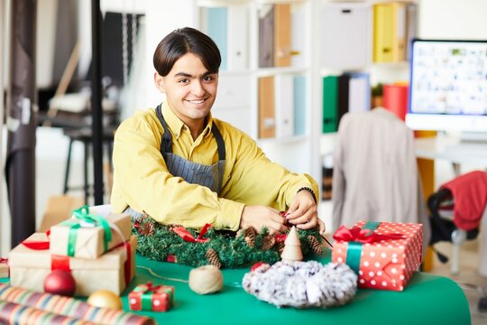 Young Man Work Making Christmas Wreath Wrapping Gifts 2