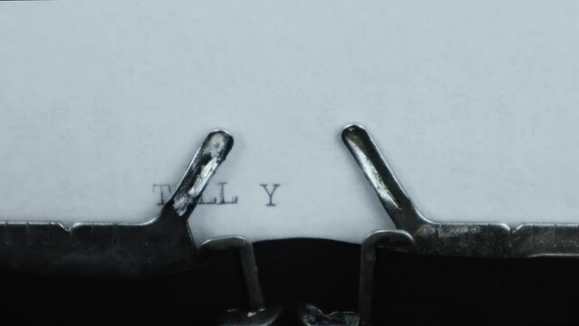 TELL YOUR STORY - typed words on a vintage typewriter. Close up. Antique Typewriter.