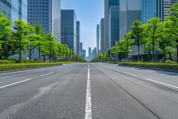 Wide empty city street flanked by green trees and modern skyscrapers