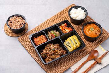 Korean food, pork, stir-fried pork, soybean paste, grilled, webfoot octopus, lunch box, egg roll, side dish, rice, kimchi,