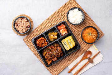 Korean food, pork, stir-fried pork, soybean paste, grilled, webfoot octopus, lunch box, egg roll, side dish, rice, kimchi,