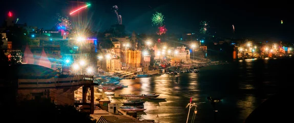 Foto auf Glas Beautiful night panorama skyline view of the ghats and Ganges River in Varanasi, India on Divali © Jeffrey