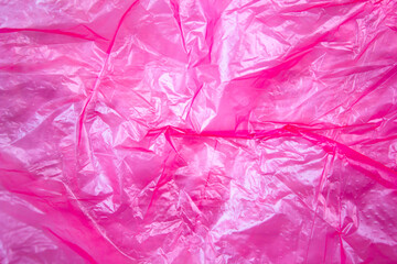 Fototapeta premium Plastic bag crumpled, background. Polyethylene film, packaging, waste recycling.