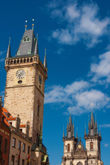 Prague Old Town Square famous landmarks. Church of Our Lady before Tyn gothic twin towers and the astronomical clock