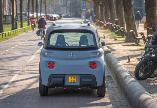Amsterdam, The Netherlands, 08.03.2024, Compact electric quadricycle Citro&euml;n Ami in the street