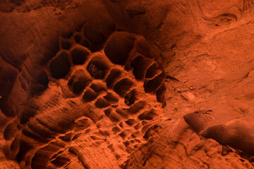 Red sandstones formations into the Foradada cave in the Areny mountain in Mont-Roig, Tarragona,...