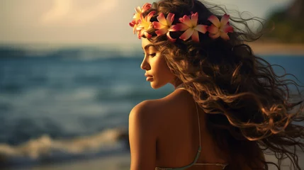 Fotobehang Woman with plumeria wreath in her hair near ocean at sunset. Summer rest. Copy space.  © Pion Studio