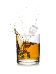 Whiskey splashing out of glass on white background