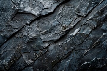 A detailed view of a rugged rock face, showcasing its texture, layers, and intricate patterns, with visible cracks and weathering.