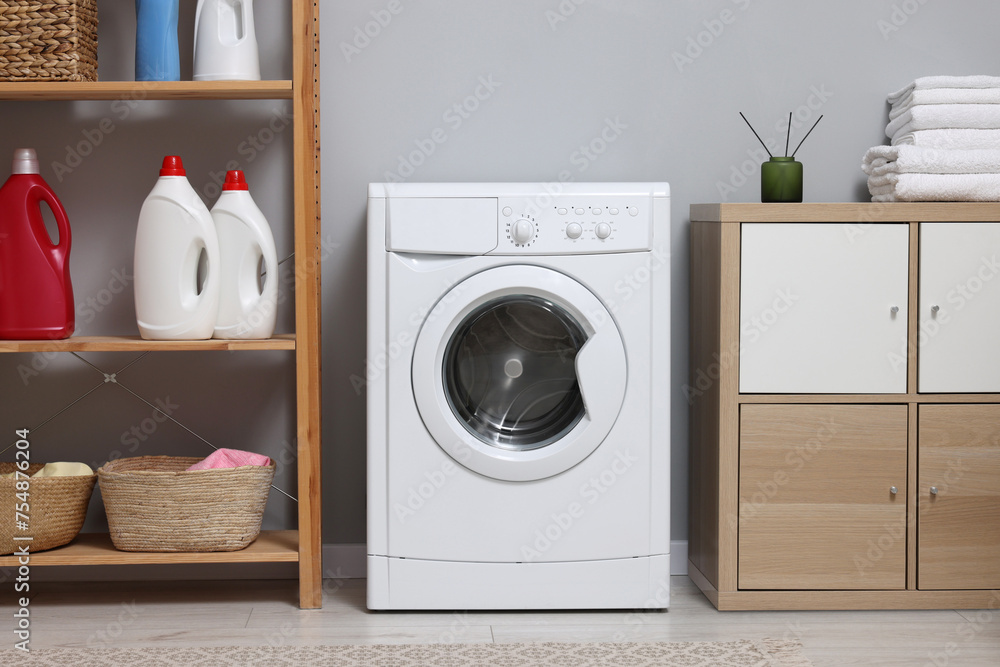 Sticker Laundry room interior with washing machine and furniture