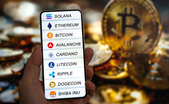Cryptocurrencies logos like bitcoin and ethereum displayed on smart device