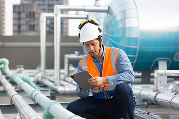 Asian male engineer working at construction site area. Male engineer worker standing near sewer...