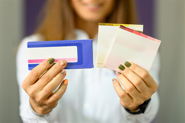 Woman holding medicine boxes in front of her