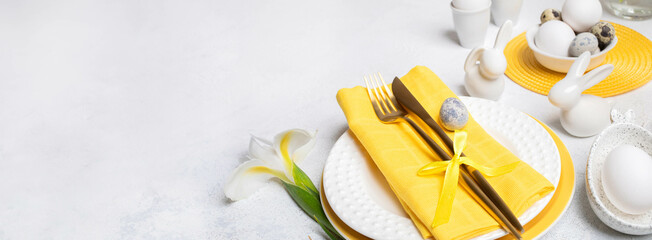Easter banner Beautiful tableware, golden cutlery, ceramic bunnies, eggs, white Iris flower on white