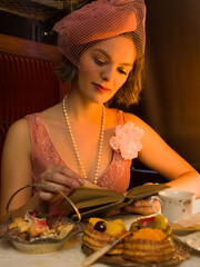 Flapper dress 1920 lady with book in antique train
