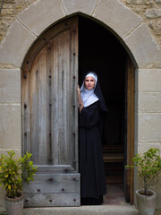 Vintage catholic nun leaving chapel
