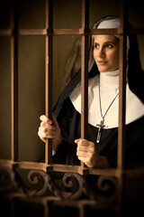 Vintage nun at convent gate