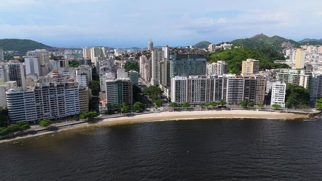 Aerial shot drone flies from sea over Flechas beach in Niter&oacute;i