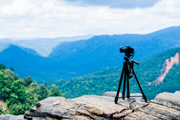 Camera on tripod with view point on mountain, Yellapur, Karnataka.