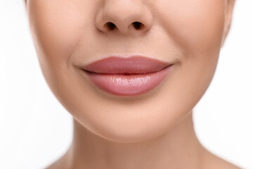 Woman with beautiful lips on white background, closeup