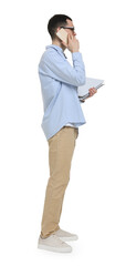 Young man in glasses holding folders and talking on mobile phone on white background
