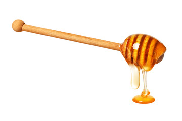 Natural honey dripping from dipper on white background