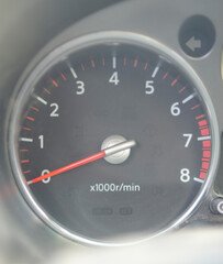 car speedometer with revolutions and number of kilometers per hour, as a concept of speed