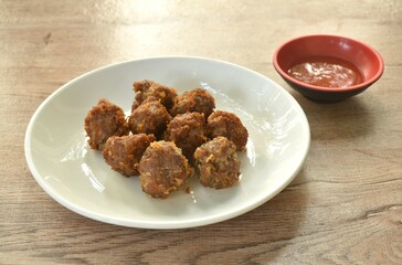 fried salt crispy chop pork with garlic dipping chili sauce on plate 