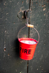 Bucket-shaped cigarette ashtray with the writing: «fire», fixed with the handles to an antique wooden door.
- 754933461
