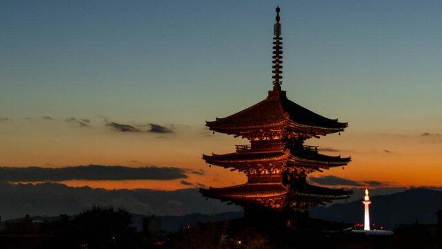timelapse kyoto city aerial skyline view to ancient Yasaka pagoda building and Kyoto Tower at the back in higashiyama, Kyoto old town with sunset sky