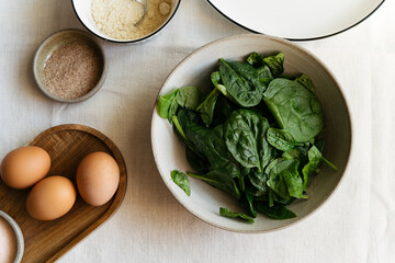 Spinach leaves in a plate. ingredients for healthy and delicious food