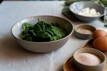 Spinach leaves in a plate. ingredients for healthy and delicious food