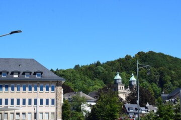 cityscape of Malmedy with the twin towers of the cathedral - obrazy, fototapety, plakaty